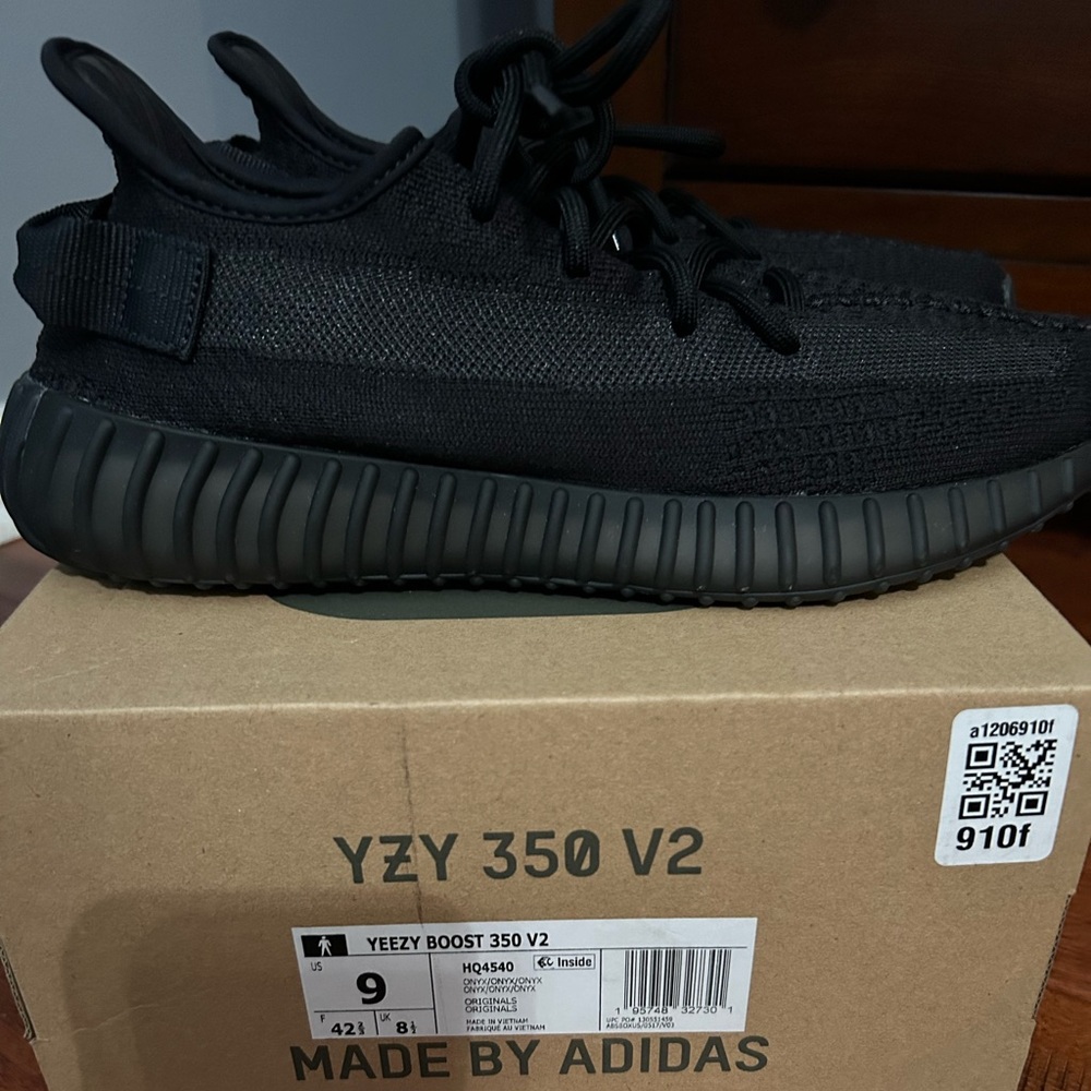 Yeezy 350 black sneakers. Excellent. Worn once.